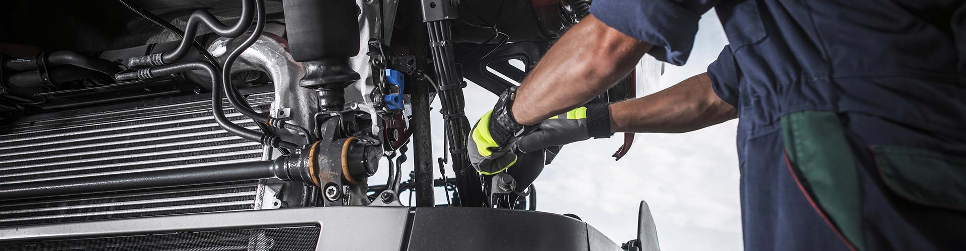 Mechanic performing vehicle maintenance with a wrench, symbolizing expert car repair in San Antonio, TX.